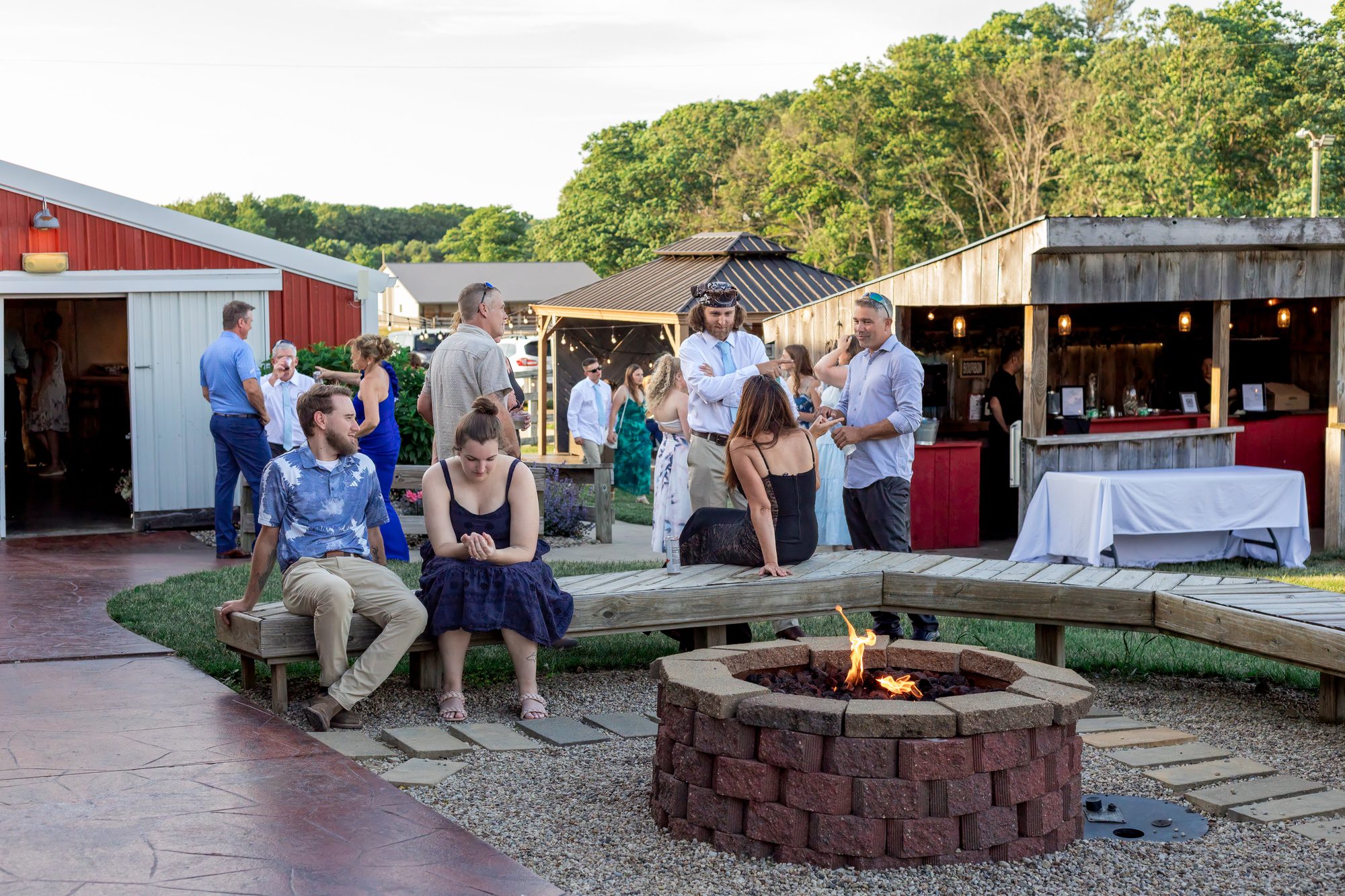 Guests around the firepit in the outdoor courtyard at Ridge View Ranch