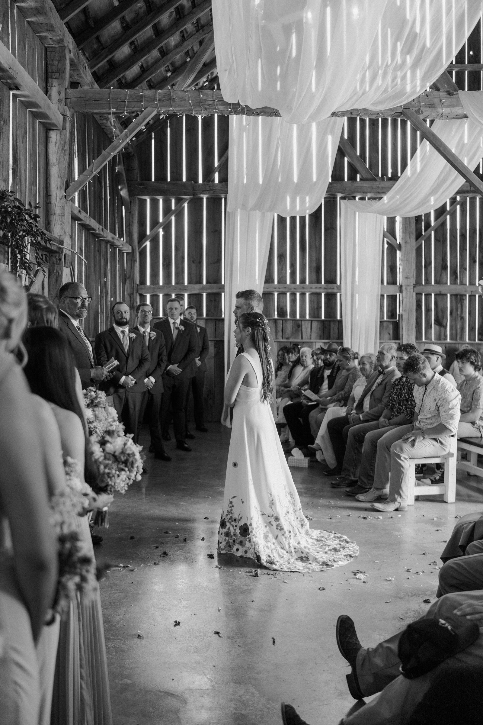 Wedding ceremony inside the historic barn at Ridge View Ranch